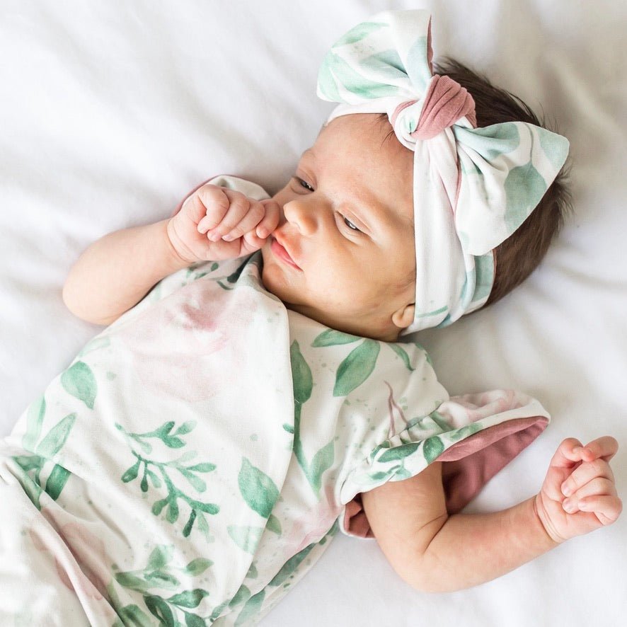 Blushing Eucalyptus short-sleeve bodysuit for baby in Classic Brushed fabric styles with a botanical design.