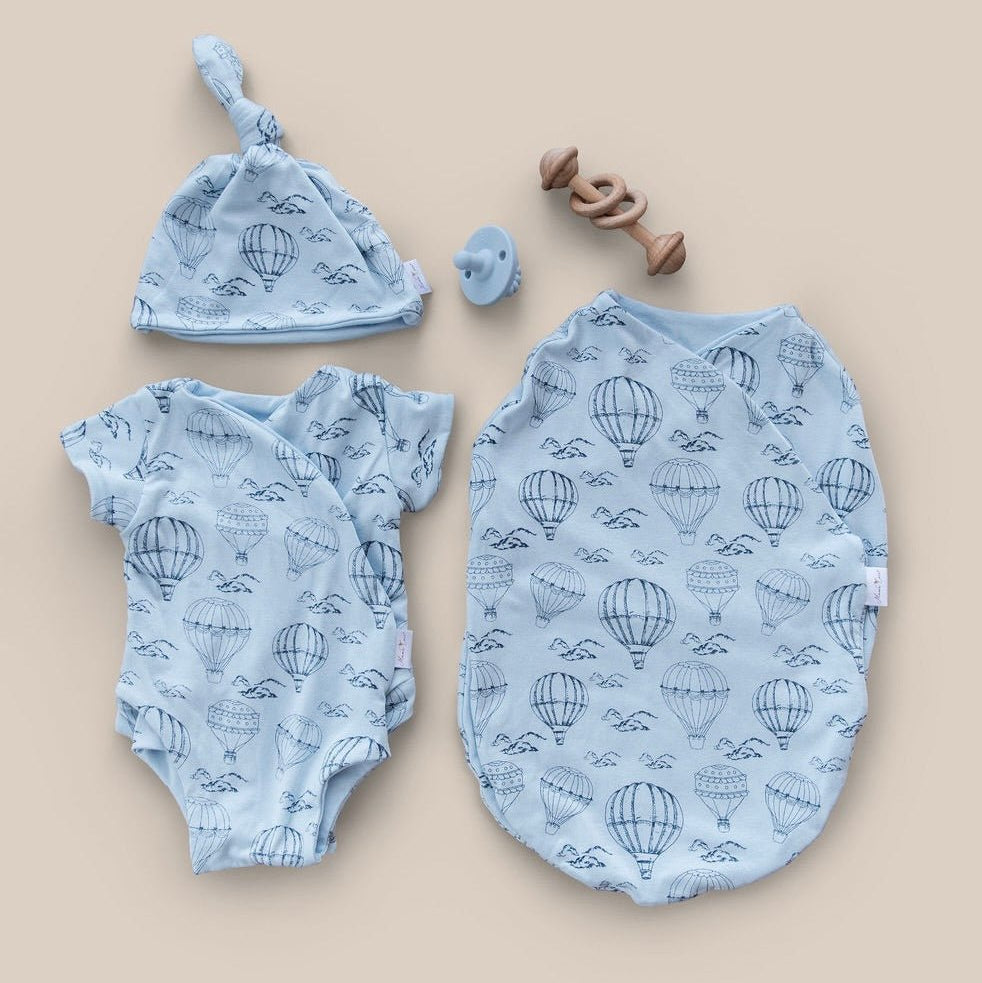 Newborn bundle with short sleeve essentials in bamboo cotton fabric with bon voyage design.
