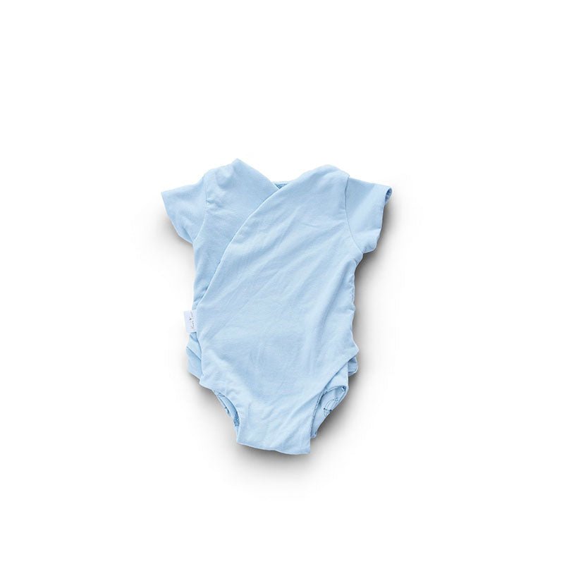 Reversible winged bodysuit for babies in bon voyage design.