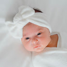 Headwrap for babies with bow, made from classic brushed fabric.
