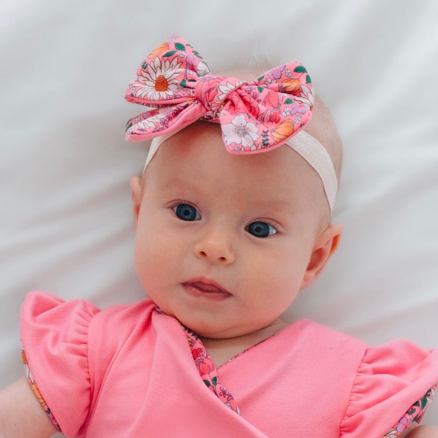 Baby headband with bow and matching bow clip in Flower Power Classic Brushed fabric.