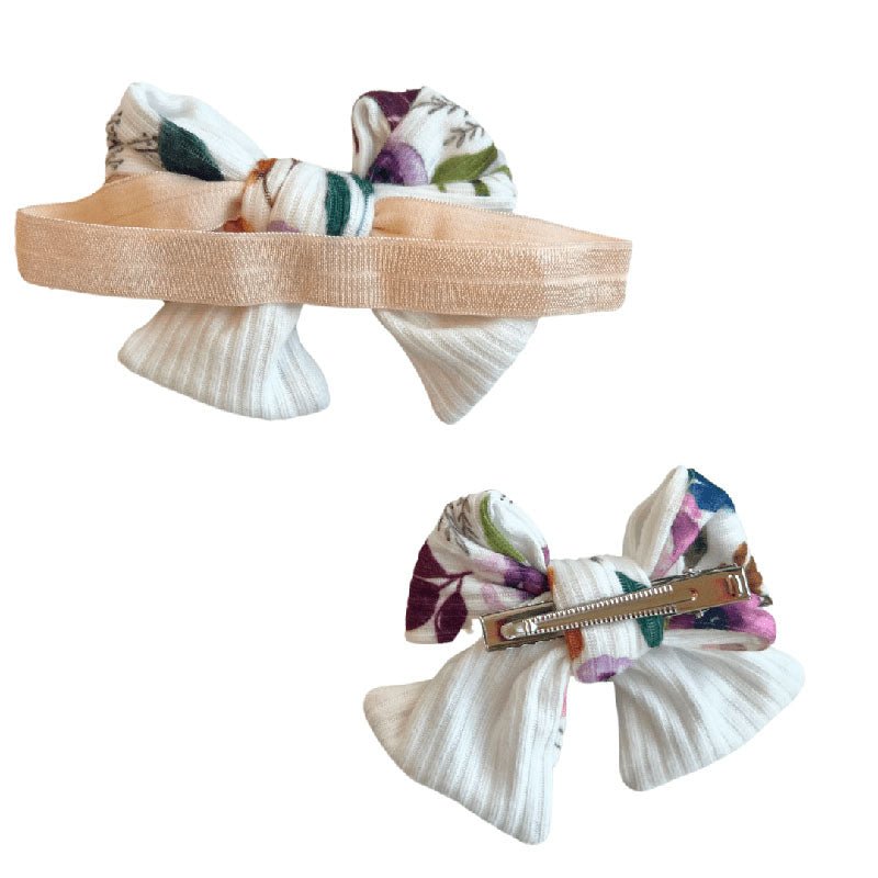 Floral baby bow headband and clip set in the Ivory Wildflowers pattern.