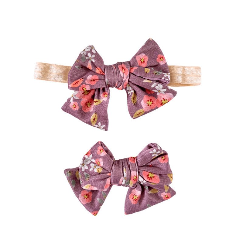 Floral baby bow headband and clip set in the Peachy Lilac pattern.