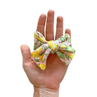 Floral baby bow headband and clip set in the Pink Lemonade pattern.