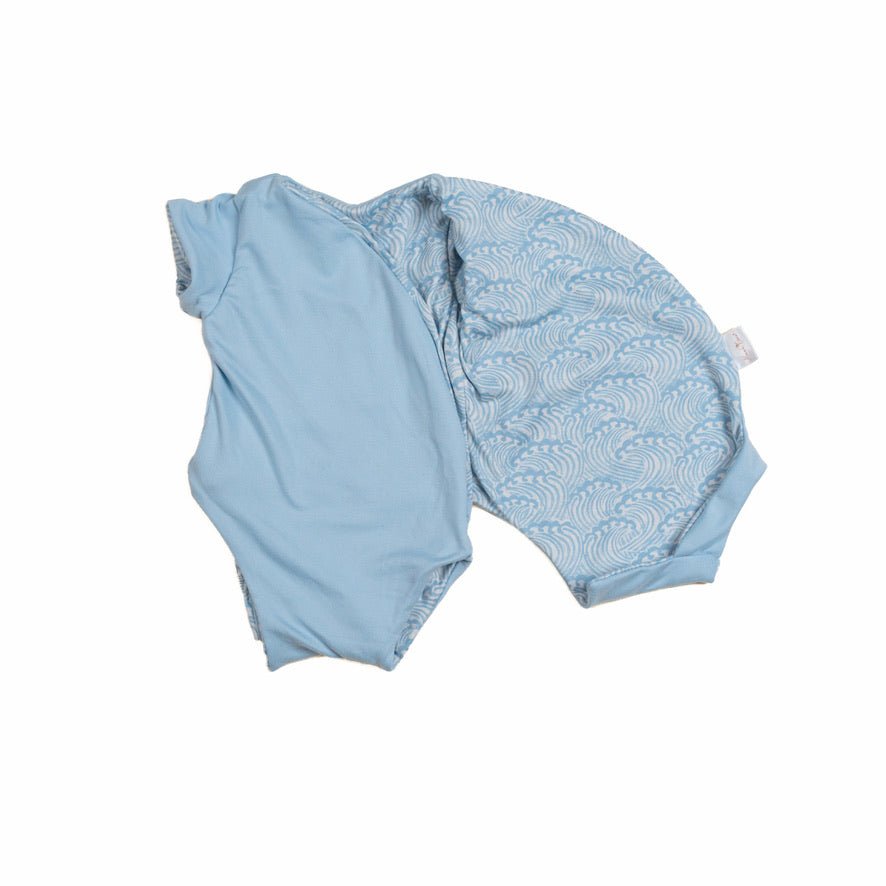 Soft reversible short-sleeve winged bodysuit in the Blue Swells design crafted from classic brushed fabric.