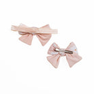 Floral baby bow headband and clip set in the Sweet Lily pattern.