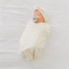 Cocoon swaddle baby blanket in Silky Modal fabric styles featuring the Bitty Blooms pattern.