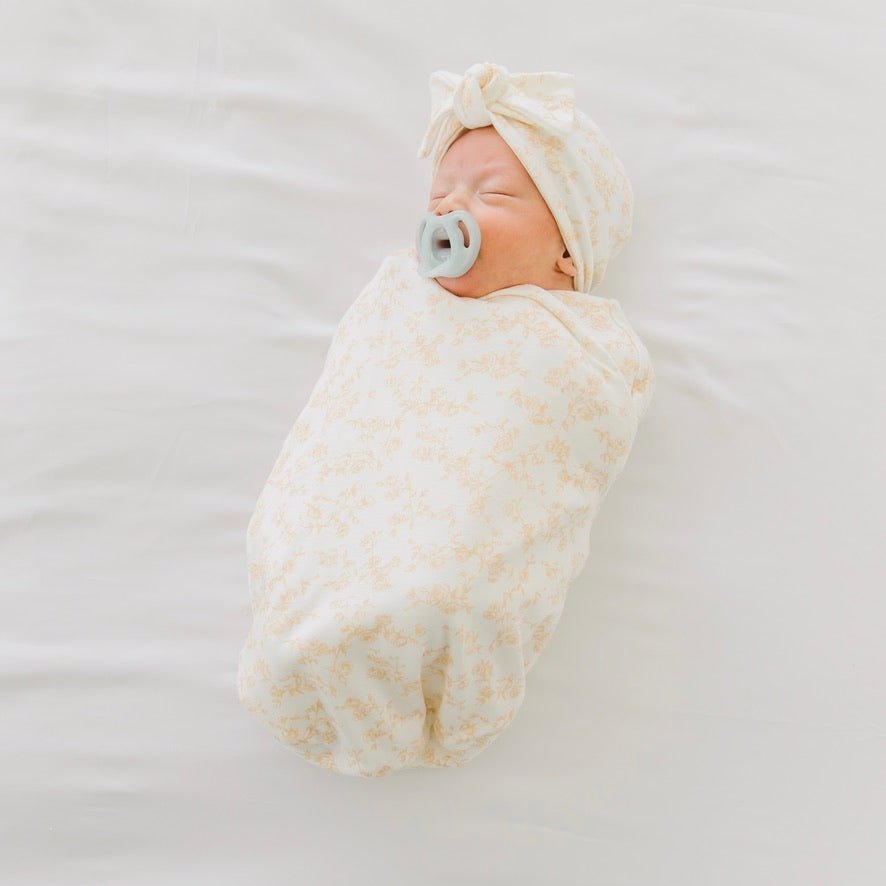 Cocoon swaddle baby blanket in Silky Modal fabric styles featuring the Bitty Blooms pattern.