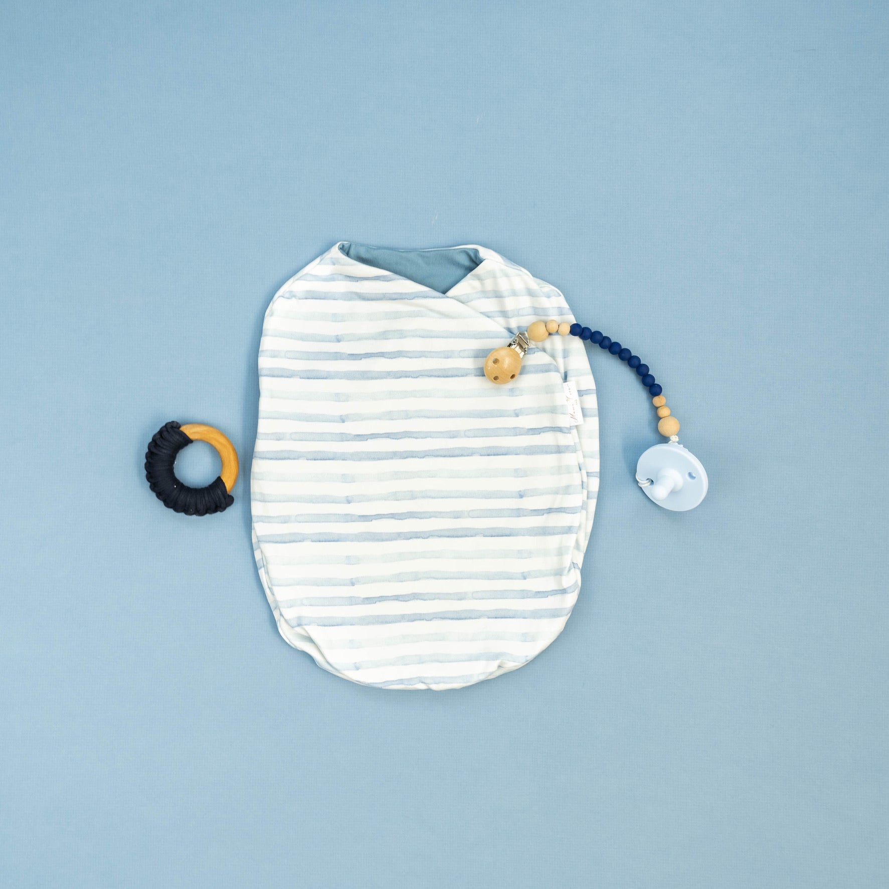 Chambray waves design cocoon baby swaddle in classic brushed fabric.