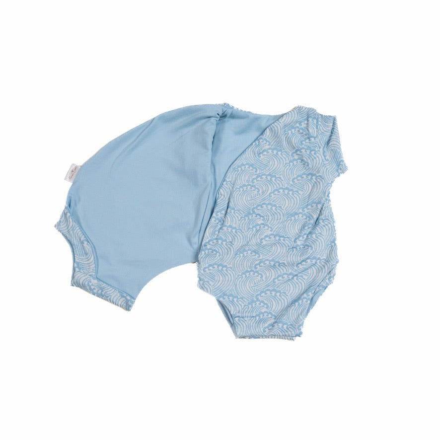 Blue Swells reversible short-sleeve winged bodysuit made from classic brushed fabric for a gentle fit.