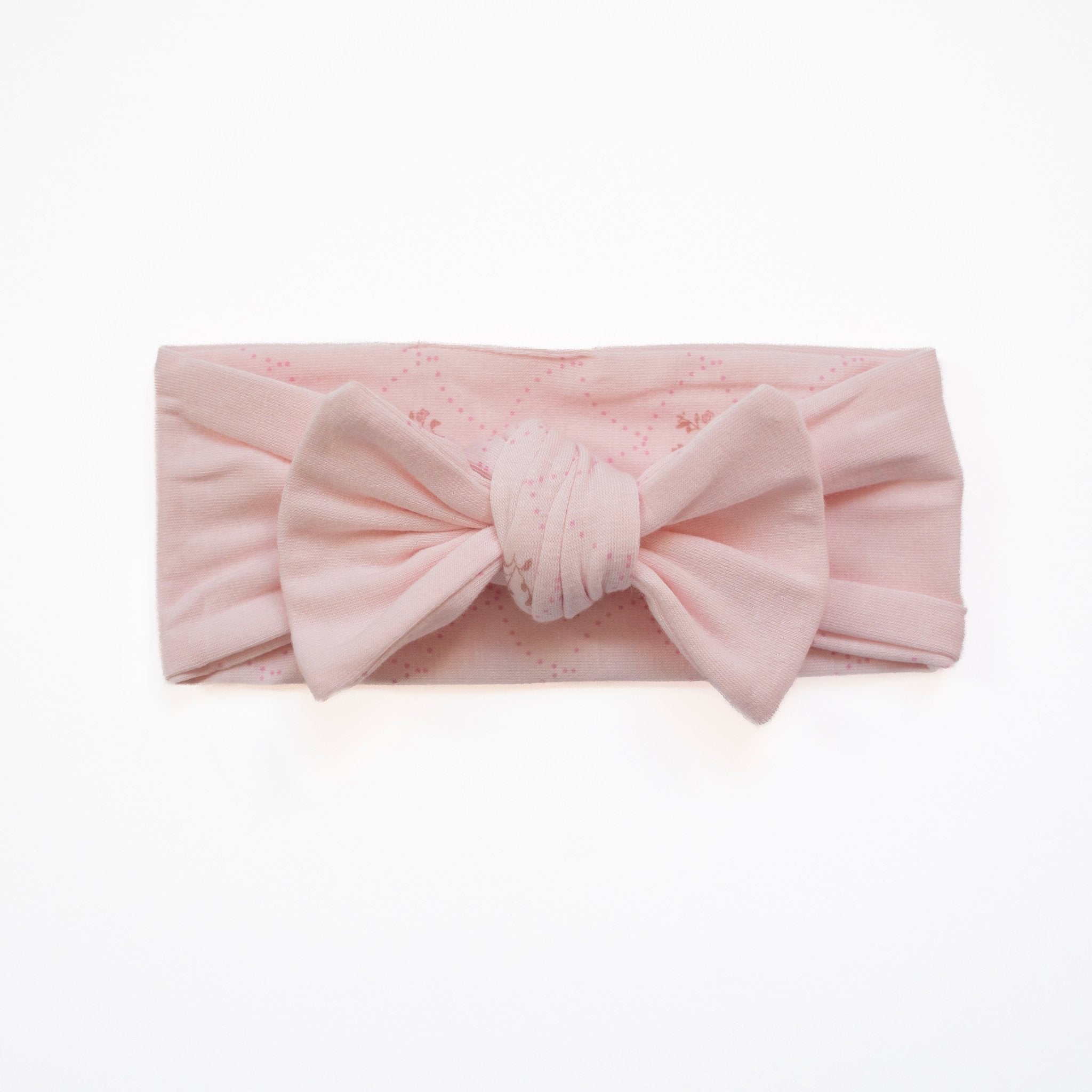 Baby bow headwrap featuring a delicate dainty dots design on bamboo and organic cotton fabric.
