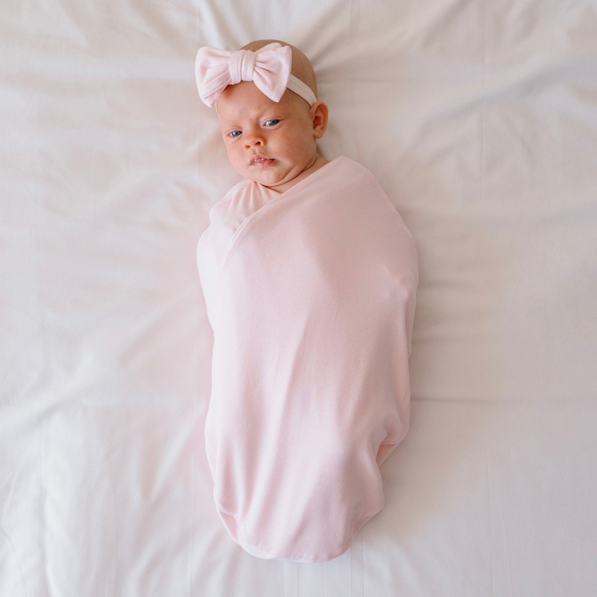 Soft and breathable baby cocoon swaddle blanket made from bamboo-organic cotton blend featuring our Dainty Dots design.