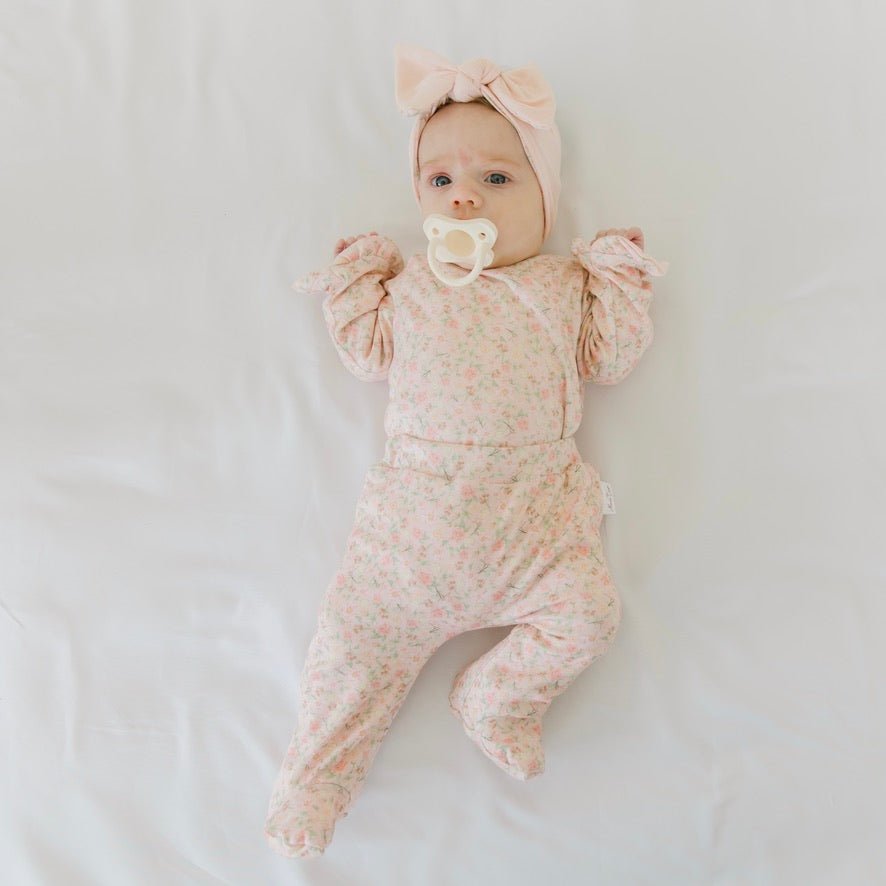 Dusty Roses baby footie pants made with breathable bamboo cotton fabric.