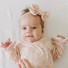 Baby headband with bow and matching bow clip in Dusty Roses Classic Brushed fabric.