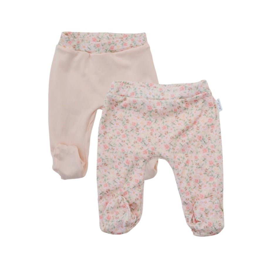 Reversible dusty roses design footie pants.