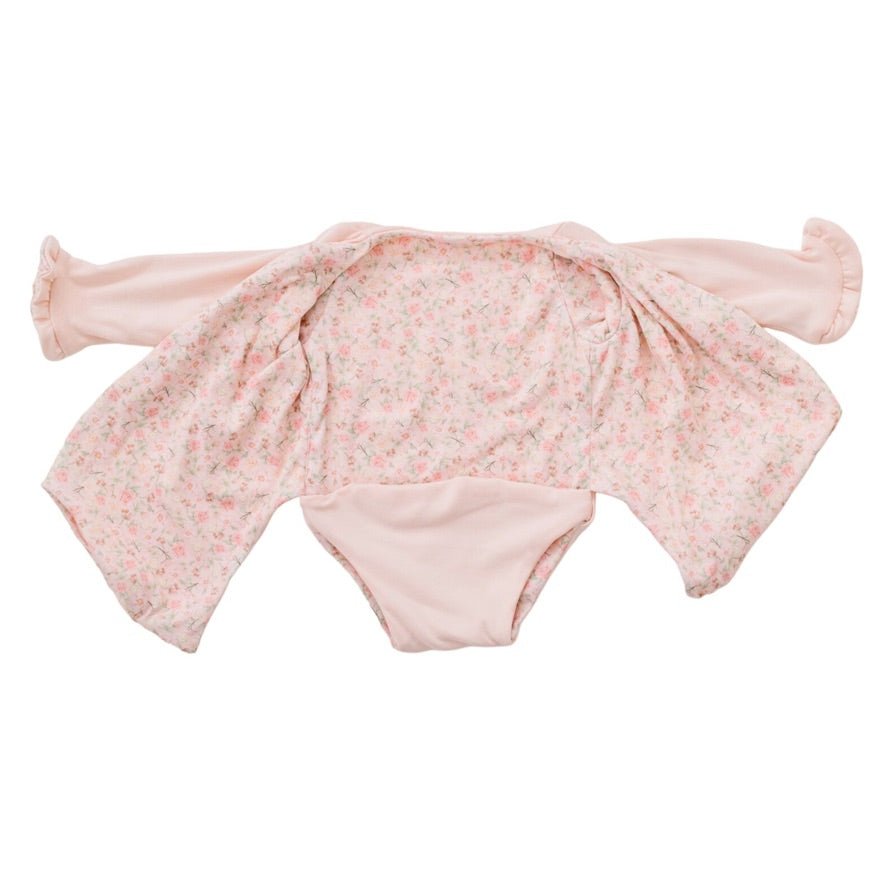 Baby long sleeve bodysuit in Dusty Roses design brushed fabric featuring wing details and ruffle cuffs.