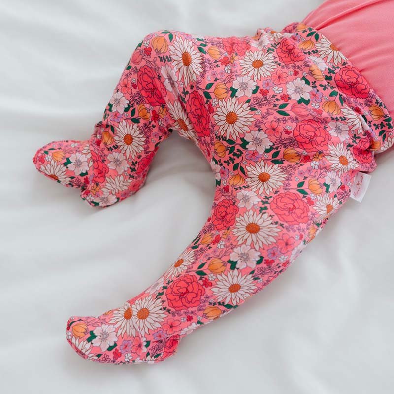 Comfortable baby footie pants made with bamboo cotton and finished in the Flower Power design.