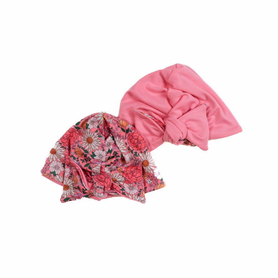 Reversible classic brushed baby knotty beanie in flower power design.