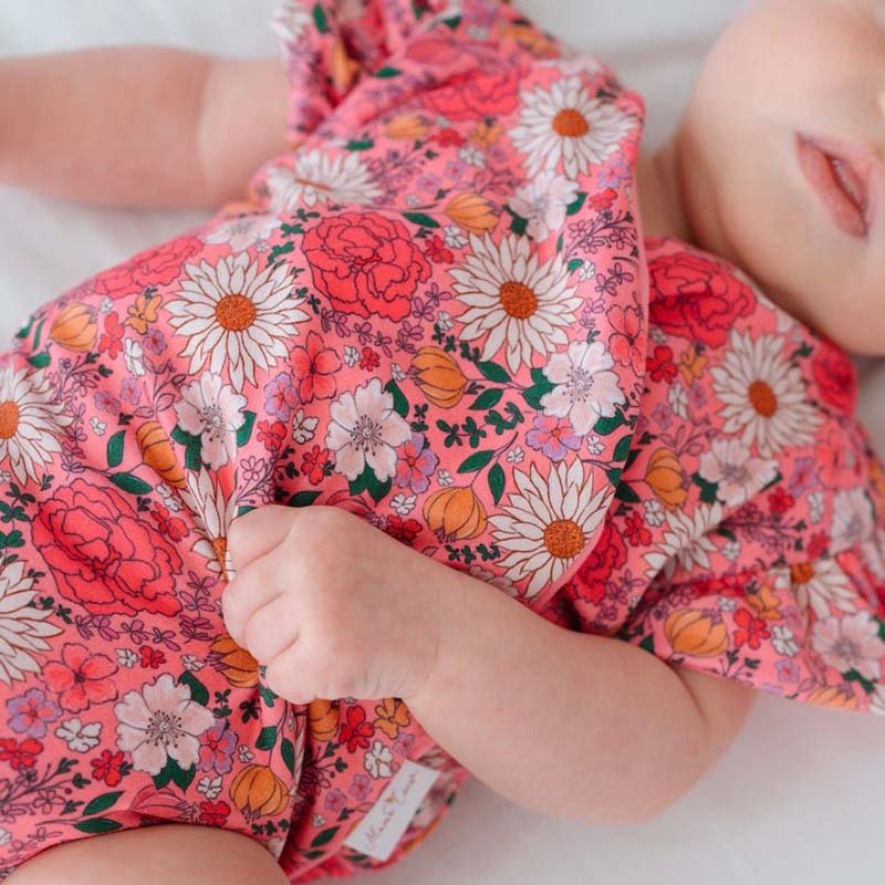 Short-sleeve bodysuit for baby in Classic Brushed fabric styles featuring Flower Power.
