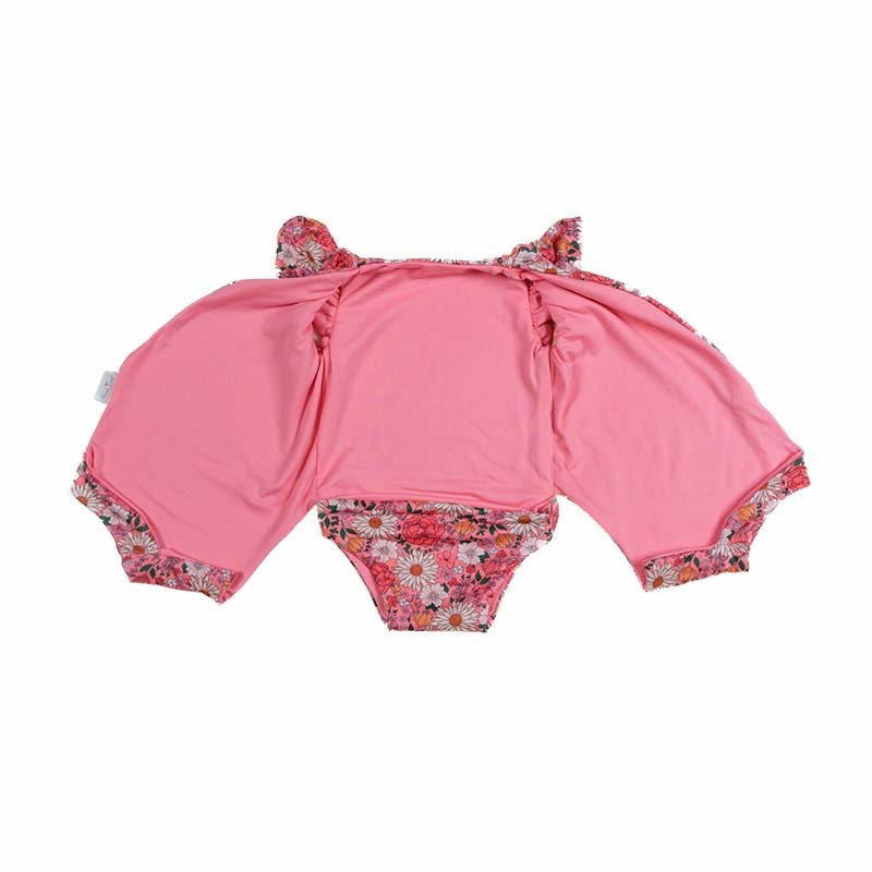 Reversible boutique baby bodysuit in Flower Power print and Classic Brushed fabric styles.