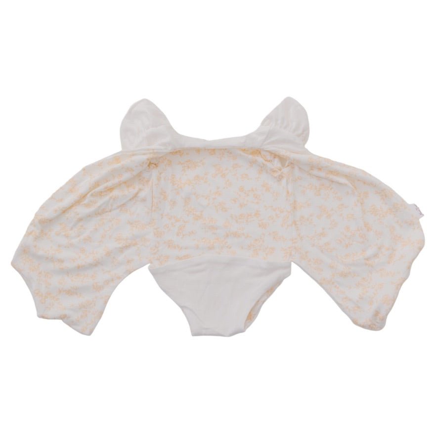 Baby flutter sleeve onesie made from silky modal fabric in Bitty Blooms design.