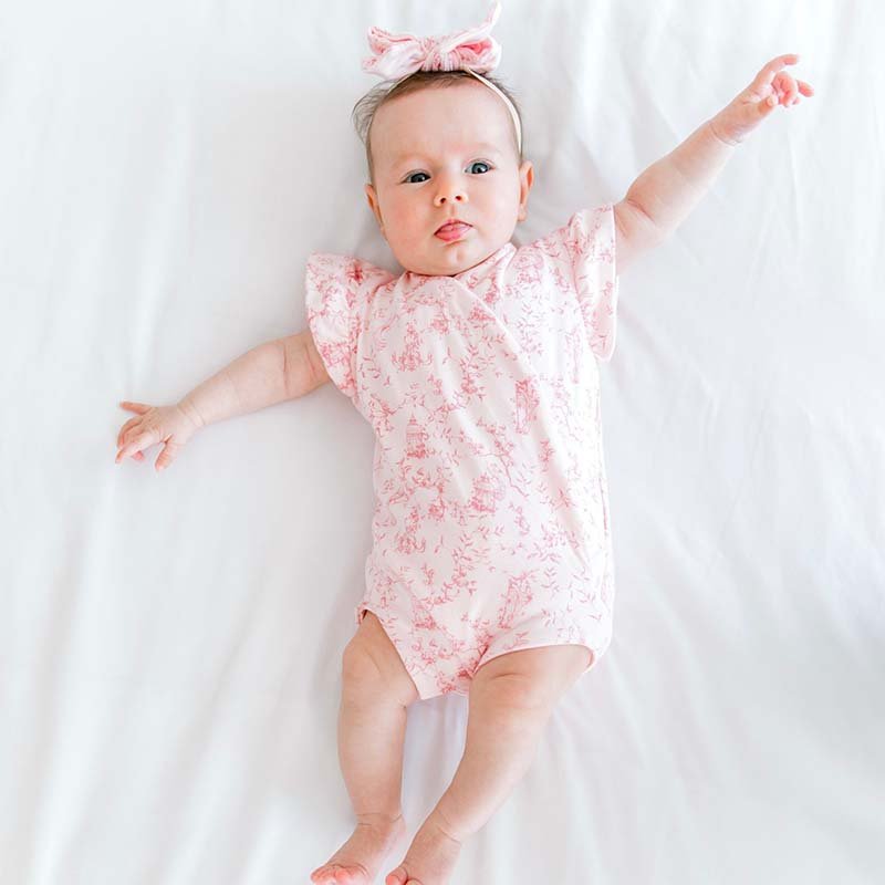 Whimsical garden flutter sleeve baby onesie outfit bundle made from bamboo cotton.