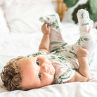 Blushing eucalyptus design flutter sleeve baby onesie.
