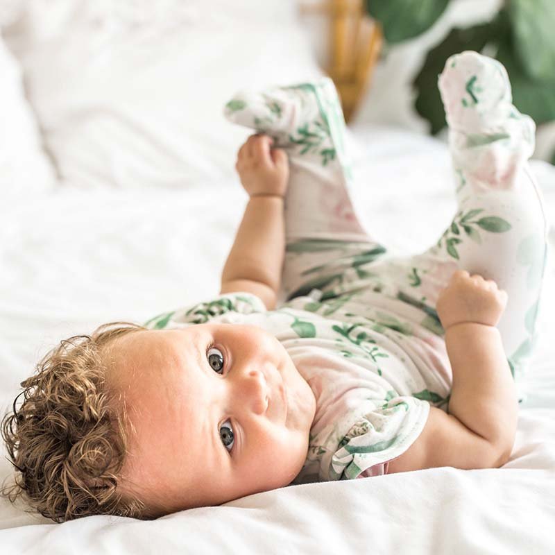 Blushing eucalyptus design flutter sleeve baby onesie.