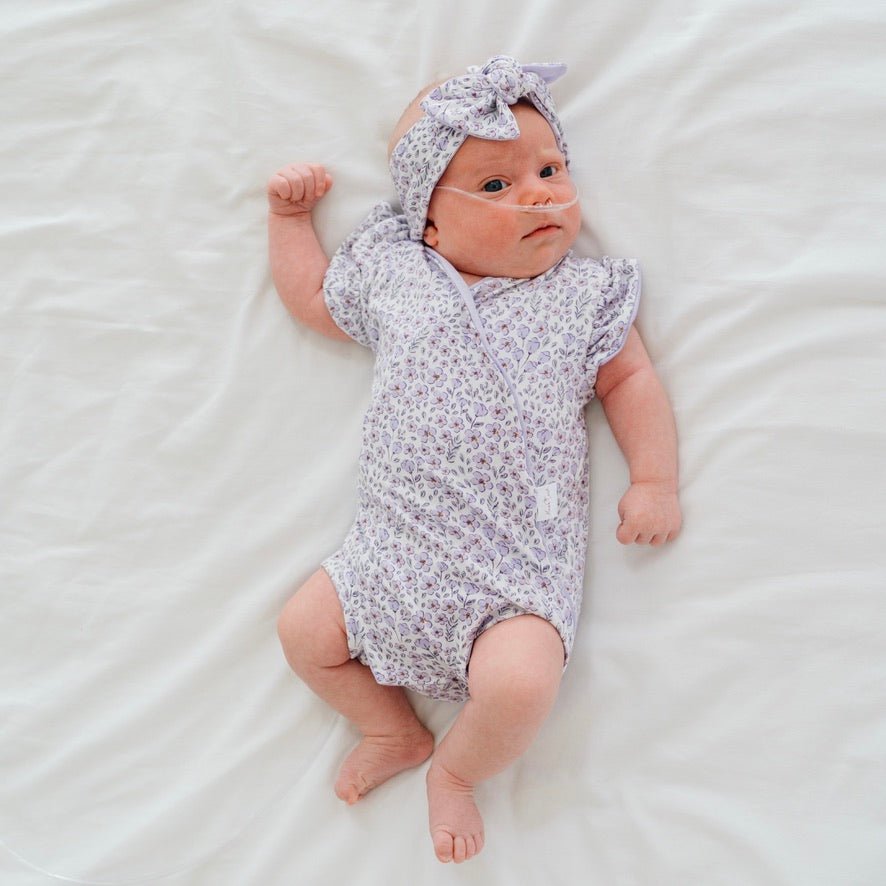 Flutter sleeve baby onesie outfit bundle made from silky modal fabric in purple posies design.