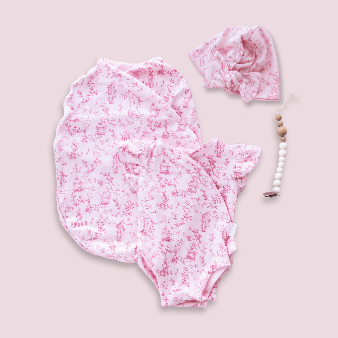 Newborn essentials bundle with flutter sleeves in bamboo cotton fabric with whimsical garden design.