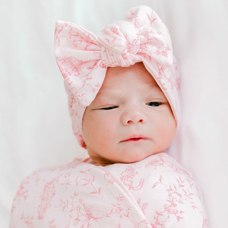 Comfortable baby bow headwrap in a charming whimsical garden print, made from bamboo and organic cotton.