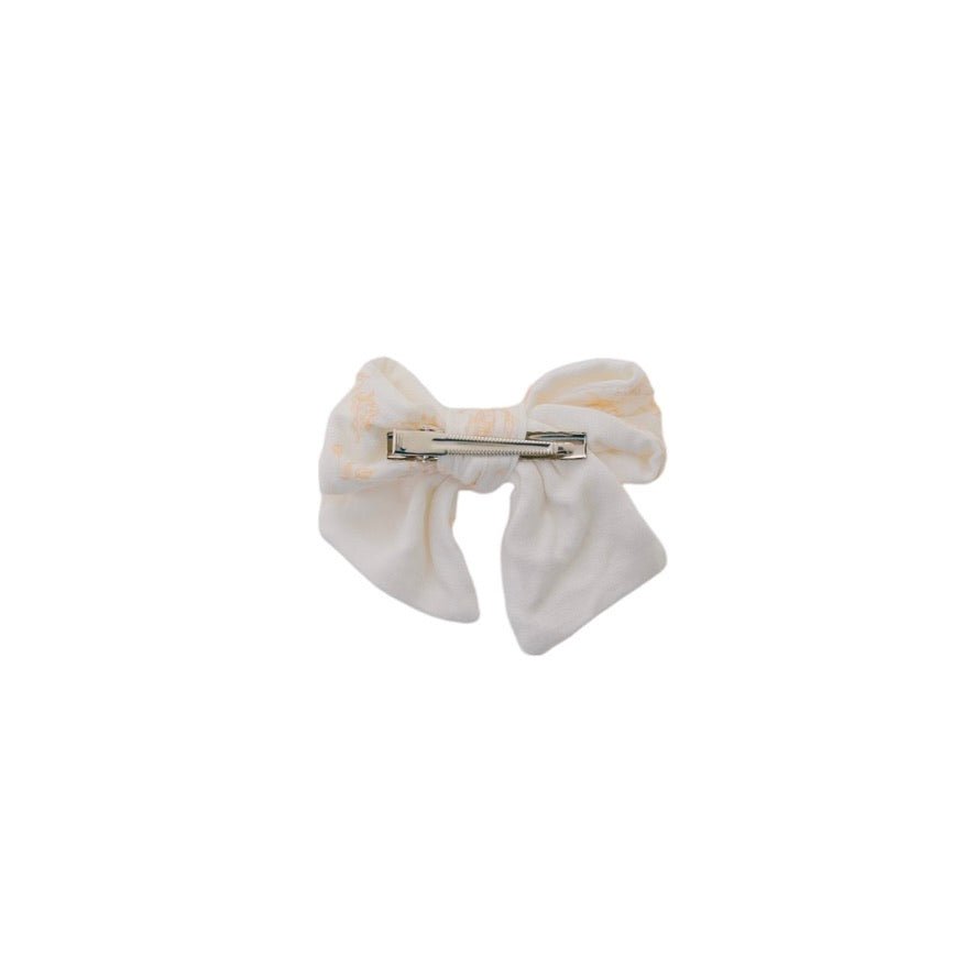 Charming headband with decorative bow in Bitty Blooms styles.