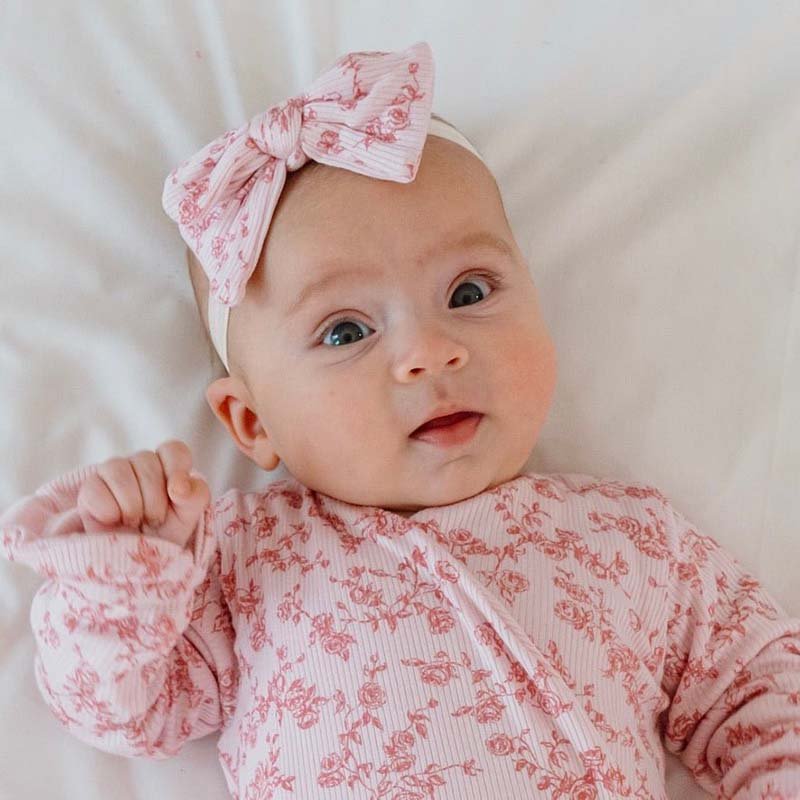 Adorable headband and bow sets available in luxurious silky modal with Bitty Pink Blooms design.