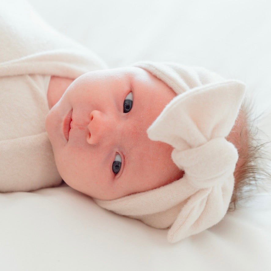 Adorable baby bow headwrap available in luxurious Plush Latte.