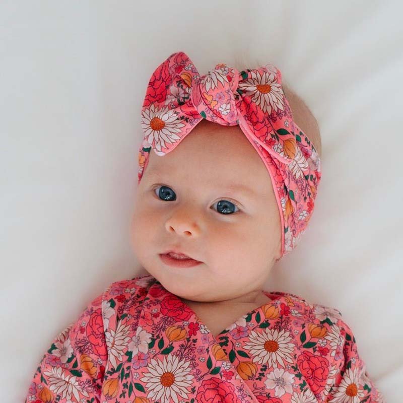 Headwrap with bow in Flower Power design, made from classic brushed fabric.