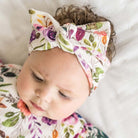 Headwrap with bow in Ivory Wildflowers design, made from classic brushed fabric.