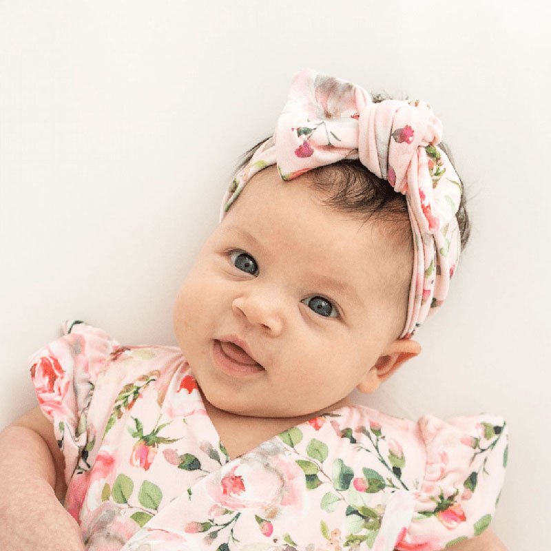 Headwrap with bow in Peachy Rose Fields design, made from classic brushed fabric.