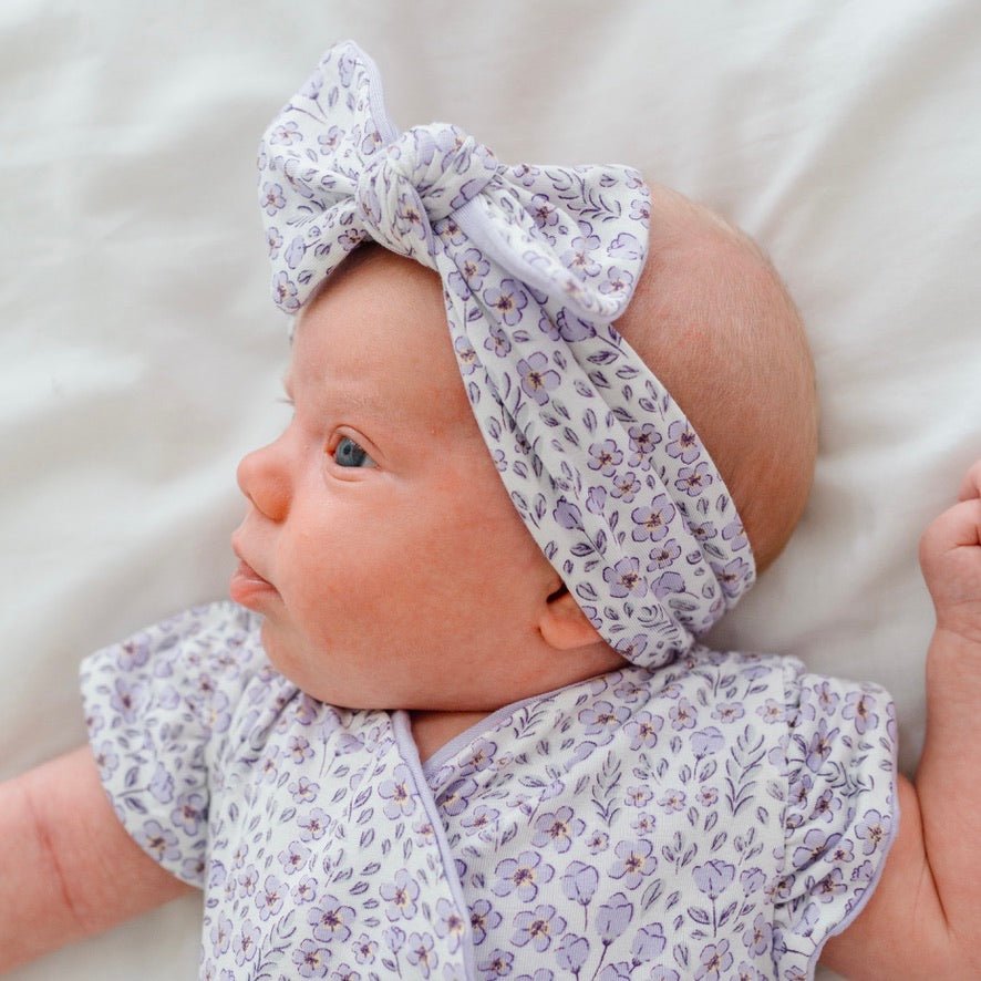Headwrap with bow in Purple Posies design, made from silky modal fabric.