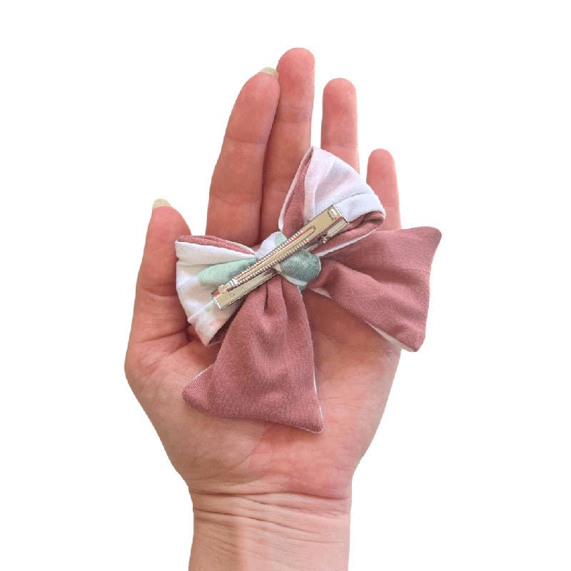 Elegant Ivory Wildflowers baby bow headband with matching hair accessory clip.
