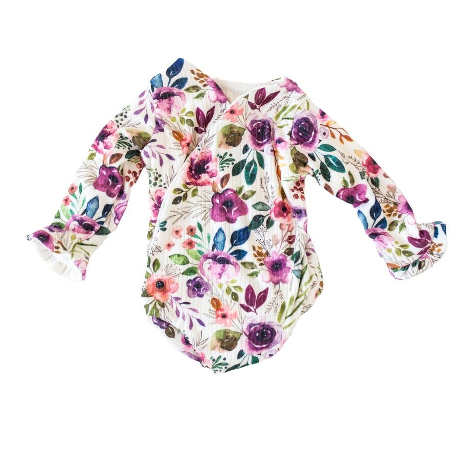 Classic brushed fabric baby bodysuit in Ivory Wildflowers design with long sleeves, winged, and ruffle cuffs.