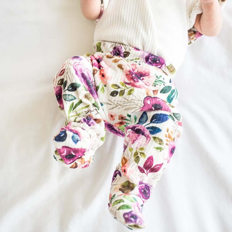 Footie pants in ivory wildflowers design.