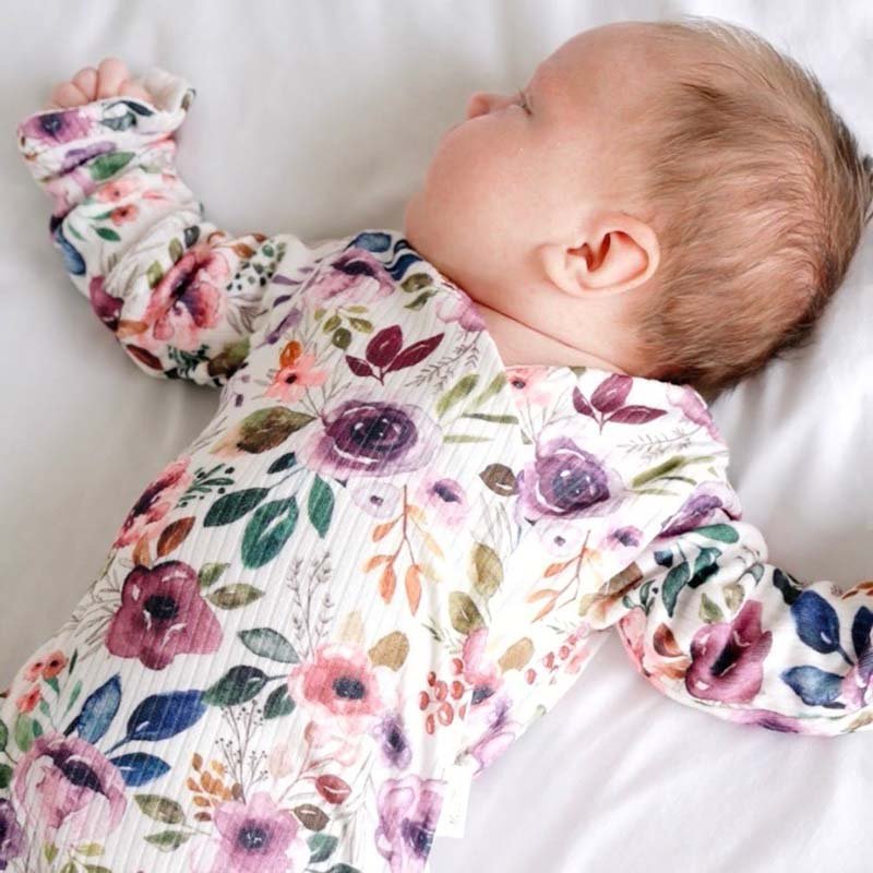 Ruffle cuff baby bodysuit with wings in Ivory Wildflowers design classic brushed fabric.