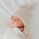Knotty beanie in Plush Latte design, made from Plush Dream fabric.