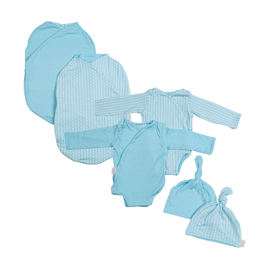Newborn bundle with long sleeve essentials in silky modal fabric with lil surfer design.