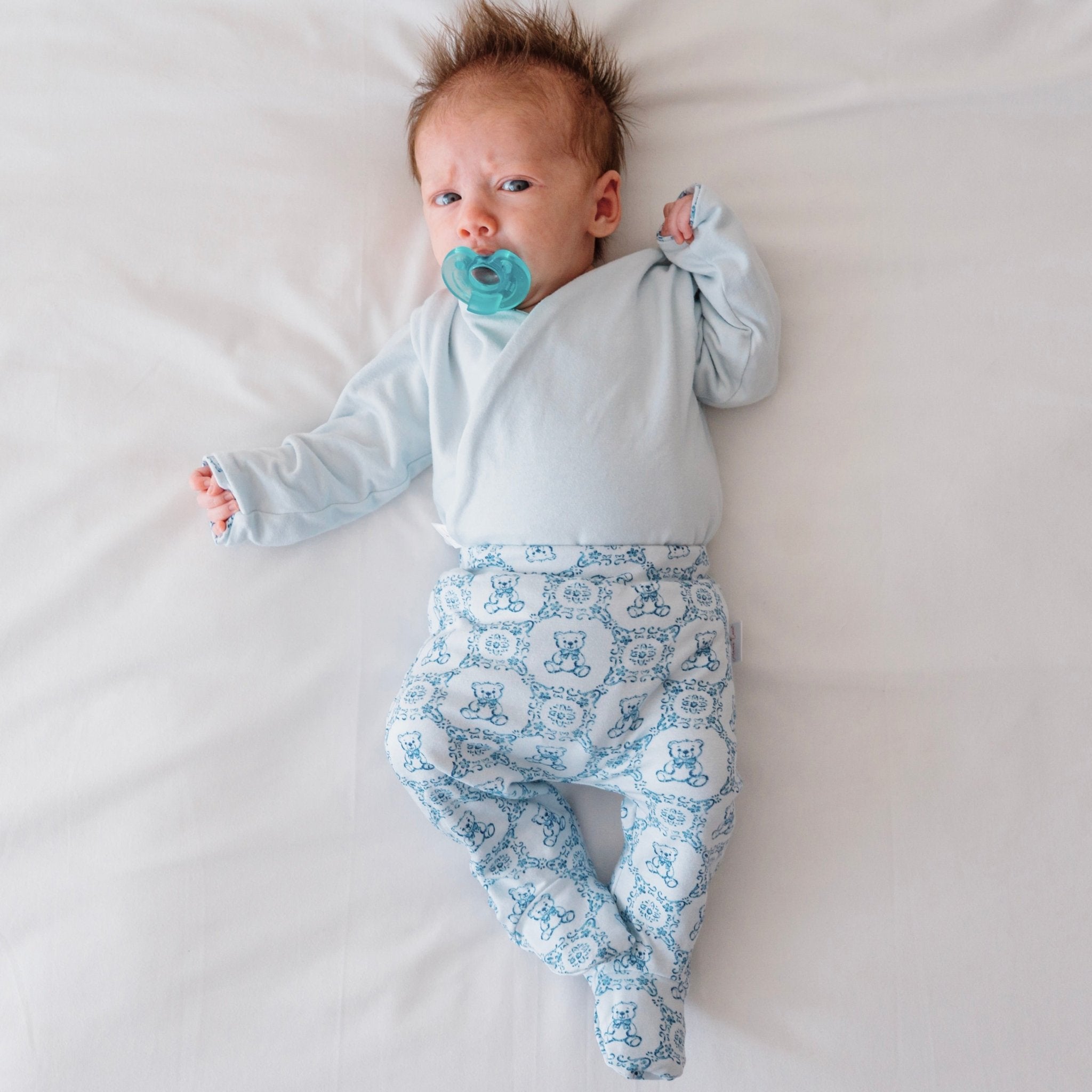 Reversible long-sleeve baby onesie outfit bundle in teddy tiles design.