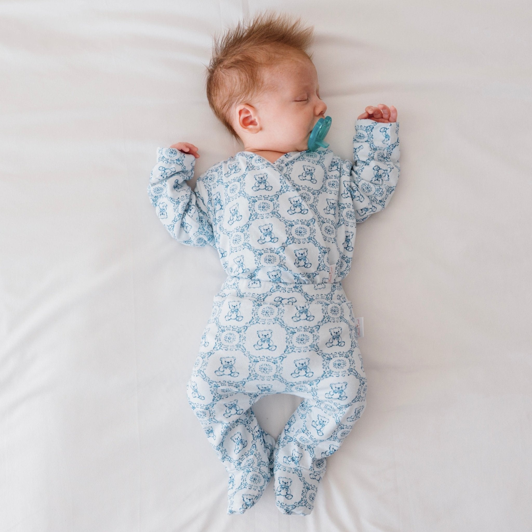 Long-sleeve baby onesie outfit bundle made from bamboo cotton in teddy tiles design.