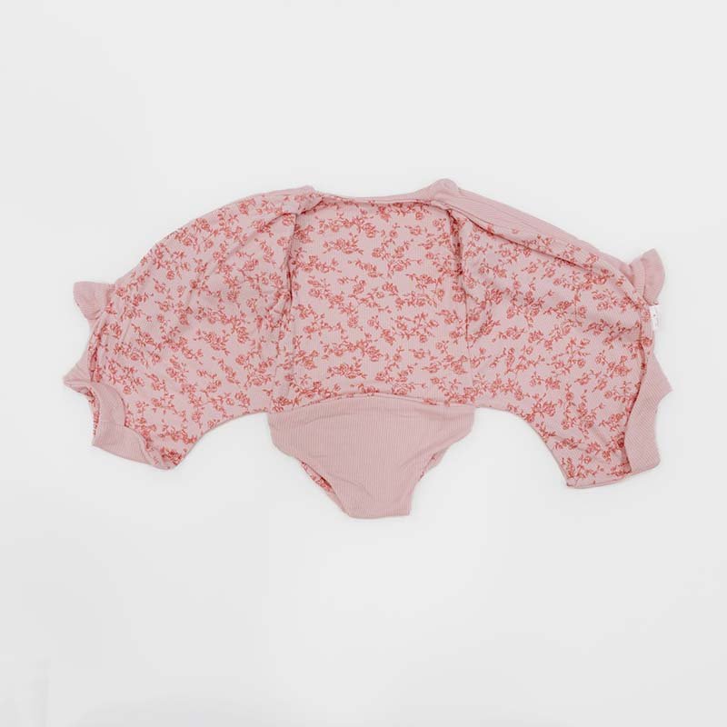Long sleeved winged bodysuit for babies in silky modal fabric.