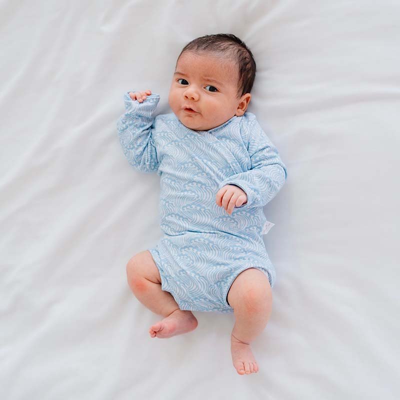 Blue Swells design long sleeve winged bodysuit.