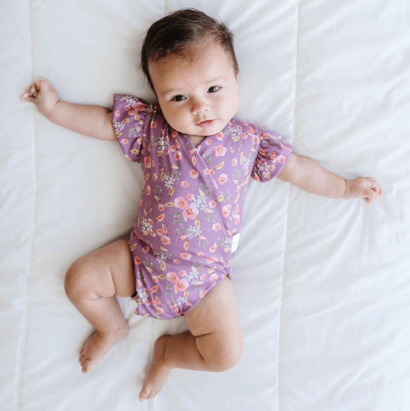 Peachy Lilac baby bodysuit with short sleeves crafted in soft Classic Brushed fabric styles.