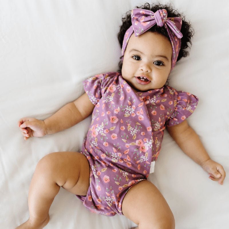 Short-sleeve bodysuit for baby in Classic Brushed fabric styles featuring Peachy Lilac.